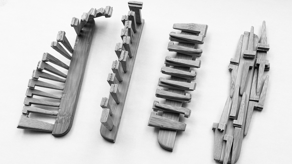 Four wooden comb sculptures, top-down