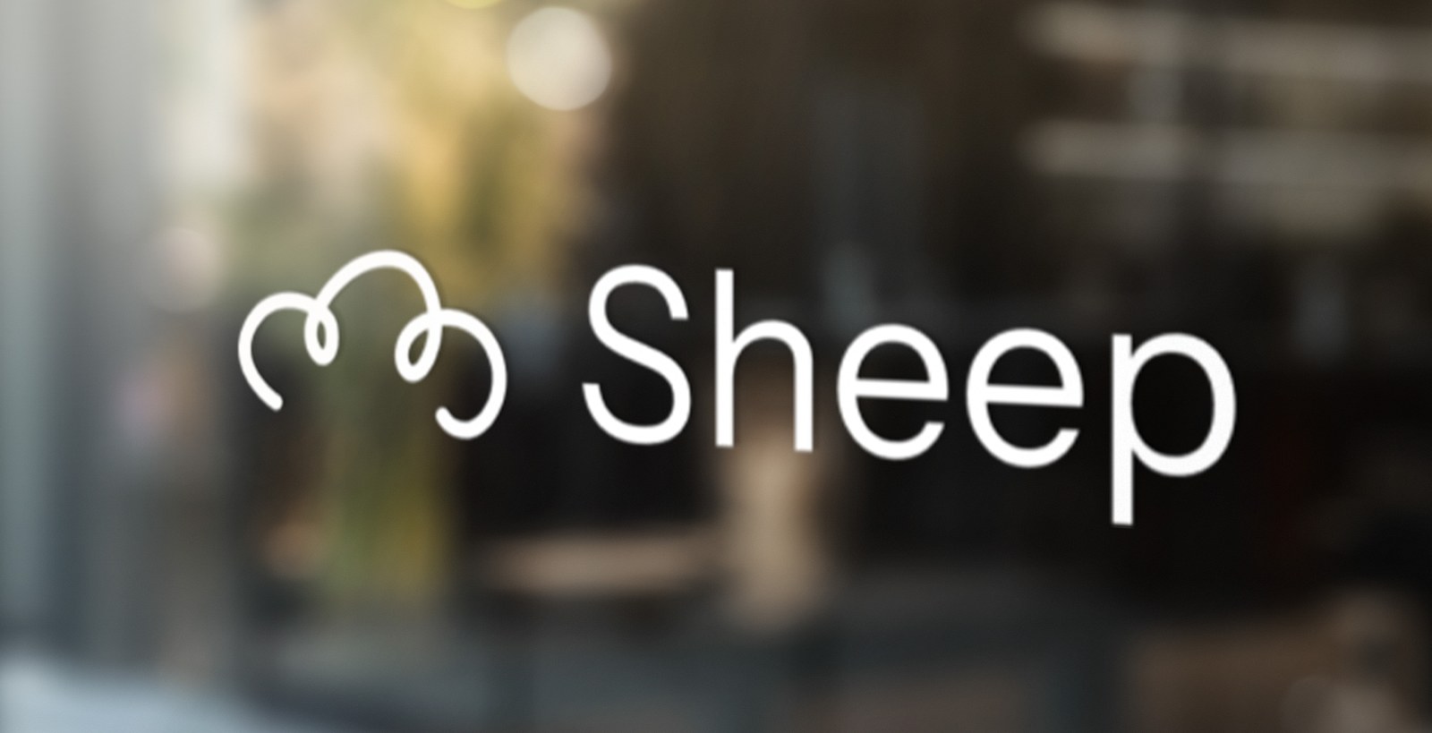 The Sheep mark applied as signage on storefront glass